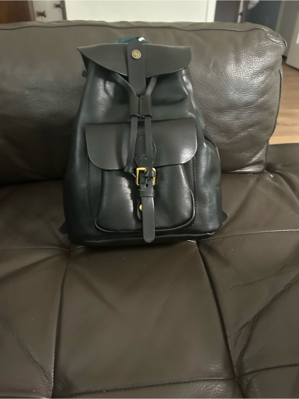 Sleek Black Leather Drawstring Backpack with Front Pocket